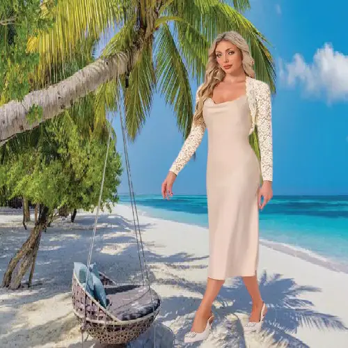 woman wearing an elegant beige long-sleeve floral lace bolero shrug over a matching sleeveless dress.
