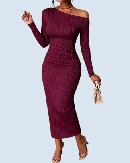 A woman modeling an elegant, form-fitting burgundy off-shoulder long-sleeve maxi dress with a textured fabric finish.