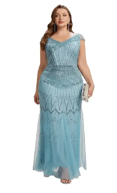 A plus-size model wearing an elegant blue maxi mermaid dress, crafted from glittering sequin fabric with cap sleeves and a V-neckline.