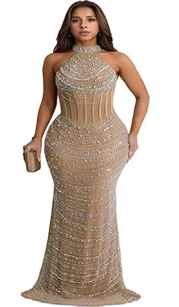 Woman wearing a nude-colored sheer mesh long evening dress covered in intricate cascading silver beaded patterns with a high halter neckline.