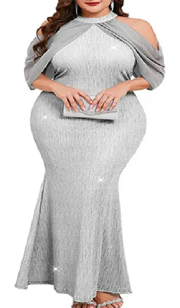 Plus size woman wearing a sparkly lavender halter neck maxi dress featuring chiffon cold-shoulder cape sleeves and a bodycon fishtail silhouette.