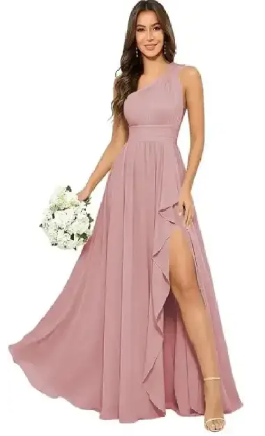 A woman modeling an elegant, dusty pink one-shoulder formal dress made of soft chiffon, featuring a side slit and a flowing, feminine drape.