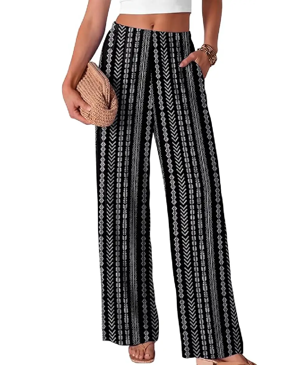 A woman wearing black and white patterned, high-waisted wide-leg pants with a relaxed, flowing fit.