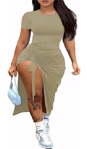 Woman wearing a short sleeve crew neck maxi dress featuring a dark black to grey and white gradient transition, complete with a side drawstring high slit.