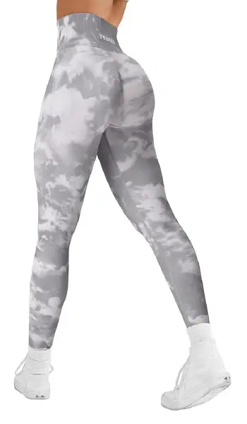 A woman modeling high-waisted, leopard print leggings with a holographic finish, featuring side pockets and back waistband storage.