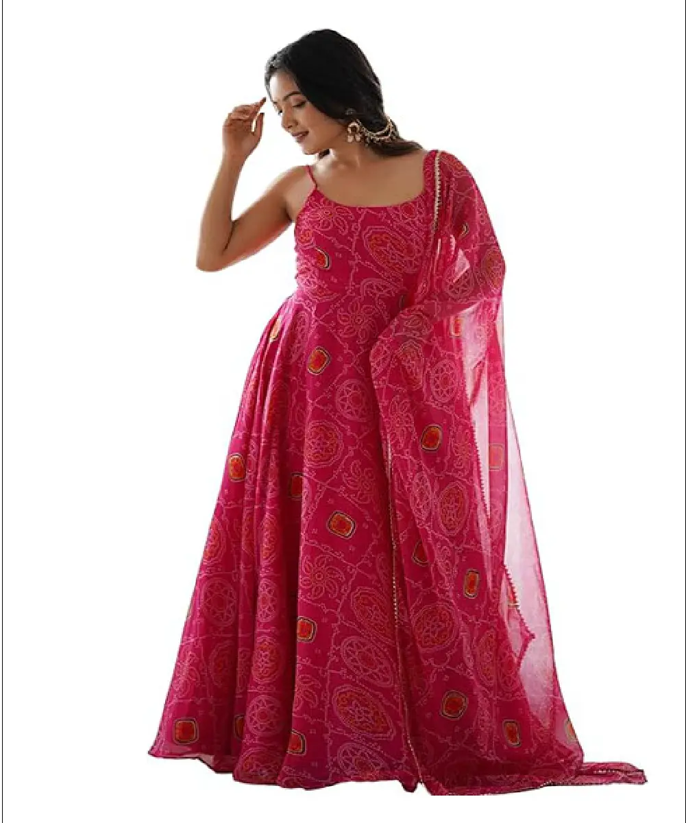 A woman wearing a navy blue floor-length gown featuring detailed sequence and stone embroidery, paired with a matching red chiffon dupatta.
