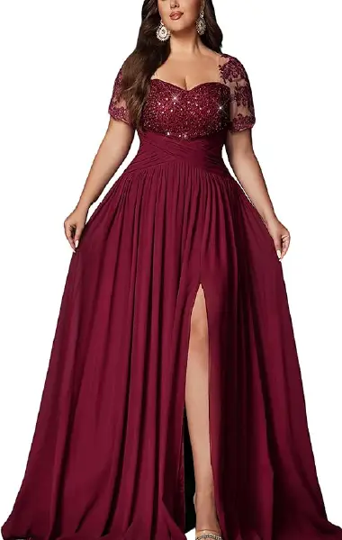A model wearing a floor-length burgundy plus-size evening gown with a sequin-embroidered bodice, short ruffle sleeves, a criss-cross high waist, and a chiffon skirt with a high-slit hemline.