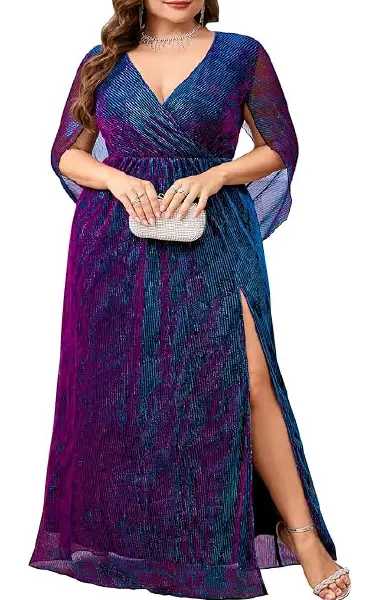 A model wearing a floor-length, multi-colored shimmering plus-size gown featuring a V-neck wrap design, flowy cape sleeves, and a sultry side slit.