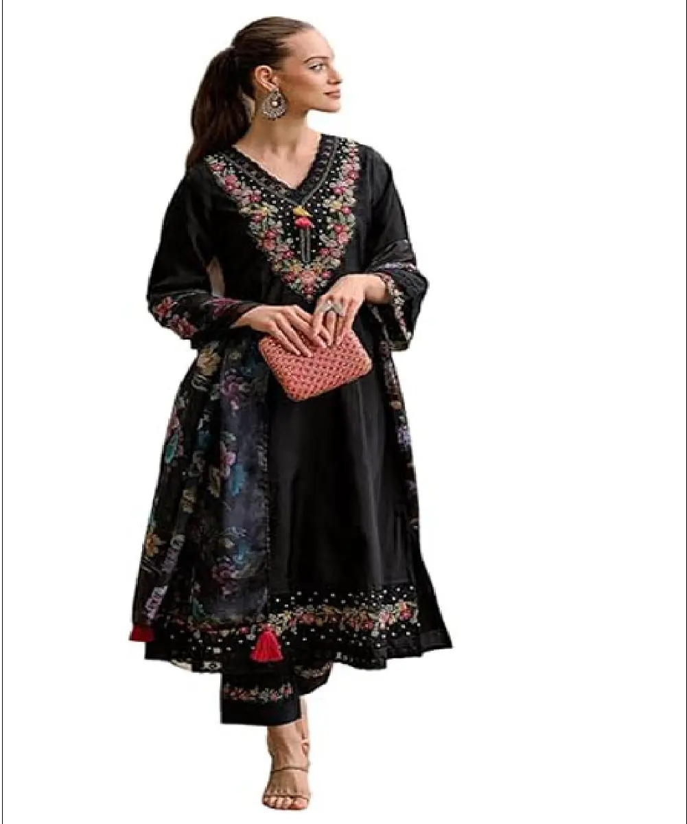 A woman wearing a vibrant mustard yellow georgette Anarkali-style kurta with intricate embroidery, paired with matching pants and a dupatta.