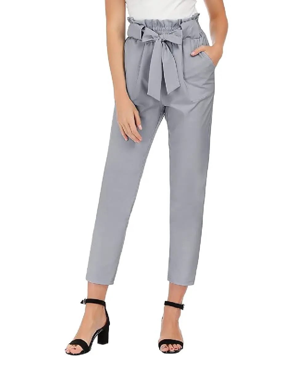A woman wearing light brown high-waisted wide-leg dress pants with side pockets and a belt, styled for a professional office look.