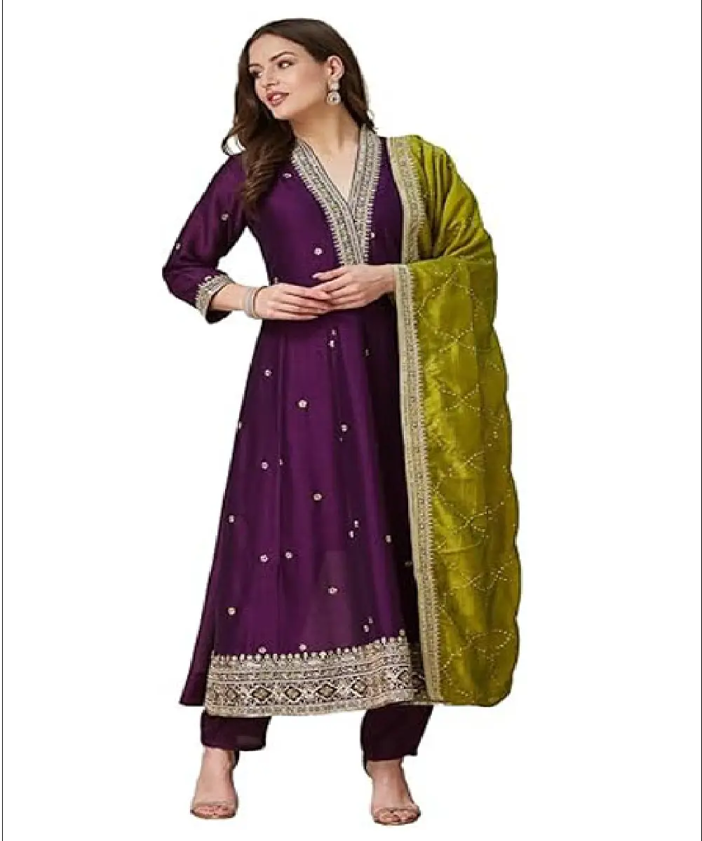 A woman wearing a vibrant mustard yellow georgette Anarkali-style kurta with intricate embroidery, paired with matching pants and a dupatta.