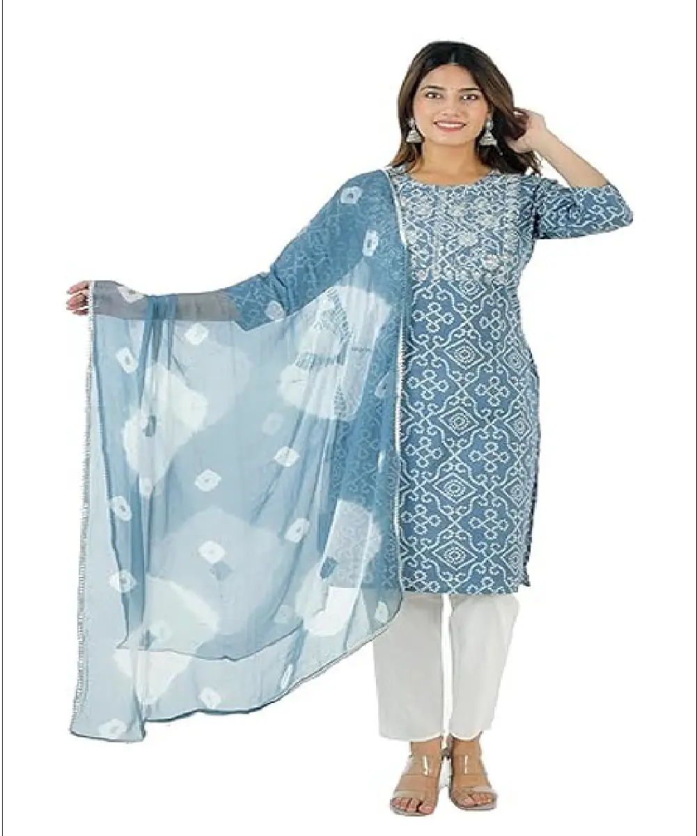 A woman wearing a vibrant mustard yellow Anarkali-style kurta with delicate floral prints, paired with matching pants and a dupatta.