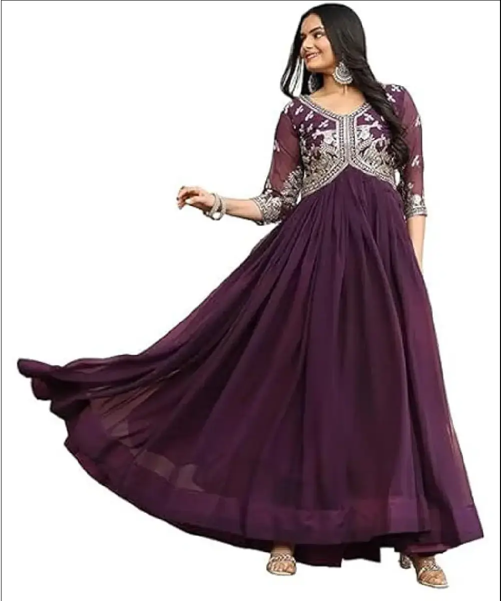 A woman modeling a long, flared purple Anarkali gown crafted from premium georgette fabric, featuring fine embroidery on the front yoke and 3/4 sleeves.
