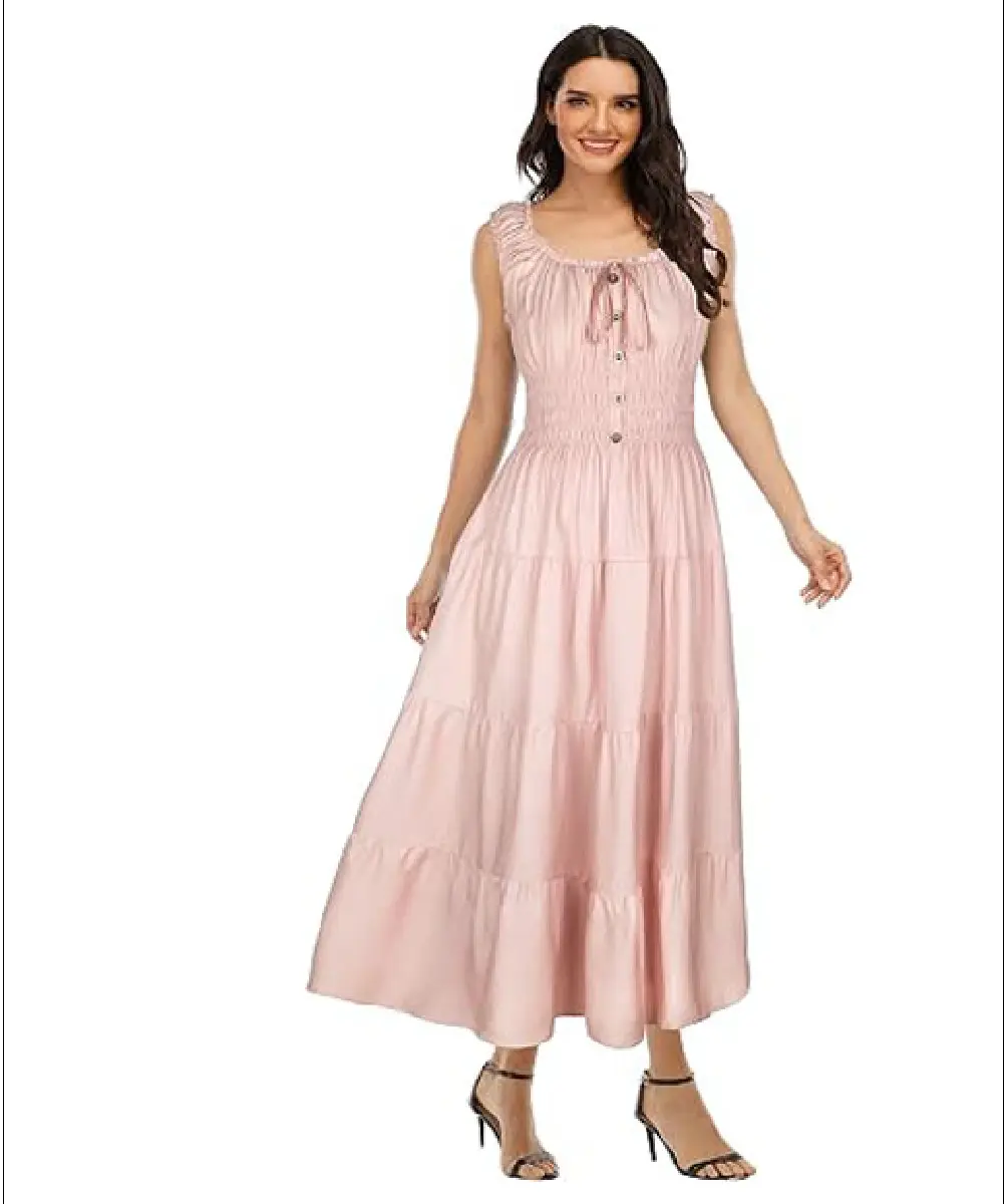A woman modeling a pastel pink, calf-length rayon kurta featuring a delicate floral print, 3/4 sleeves, and a matching dupatta.