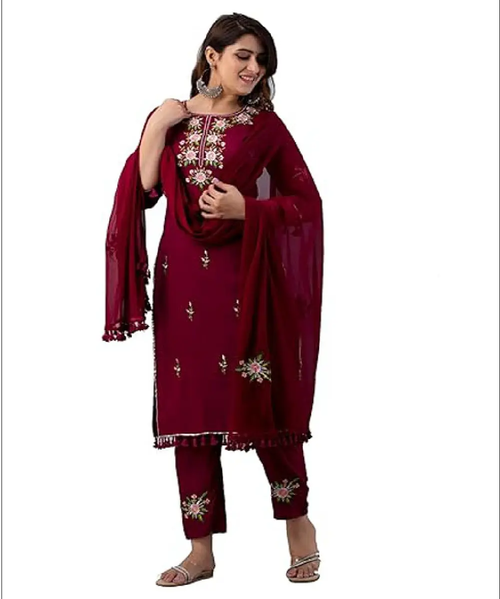A woman modeling a pastel pink, calf-length rayon kurta featuring a delicate floral print, 3/4 sleeves, and a matching dupatta.