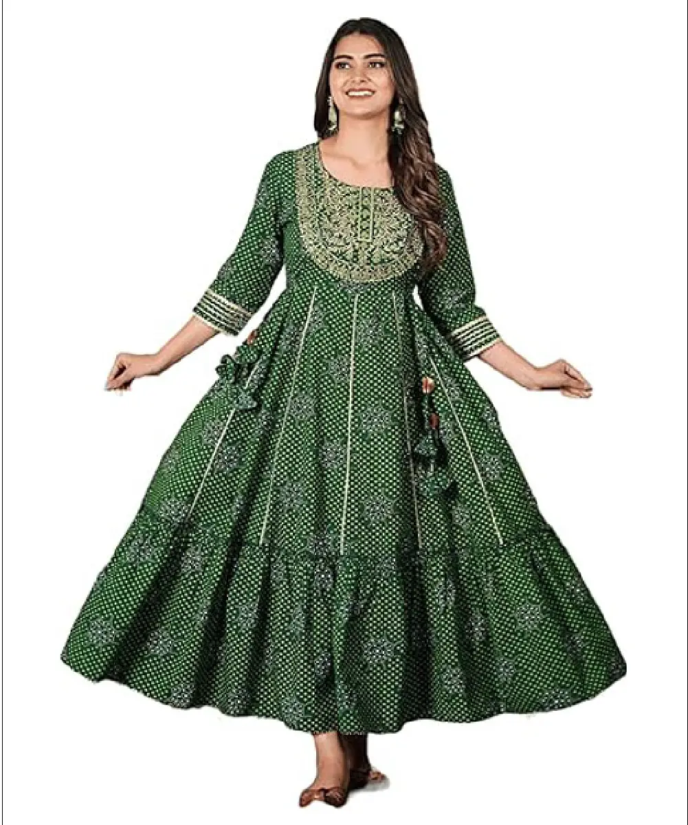 A woman wearing a long, flared green cotton Anarkali kurta featuring a round neck, intricate embroidery, and 3/4 sleeves.