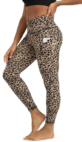 A woman modeling high-rise, leopard print leggings that feature convenient deep side pockets, captured in a profile view.