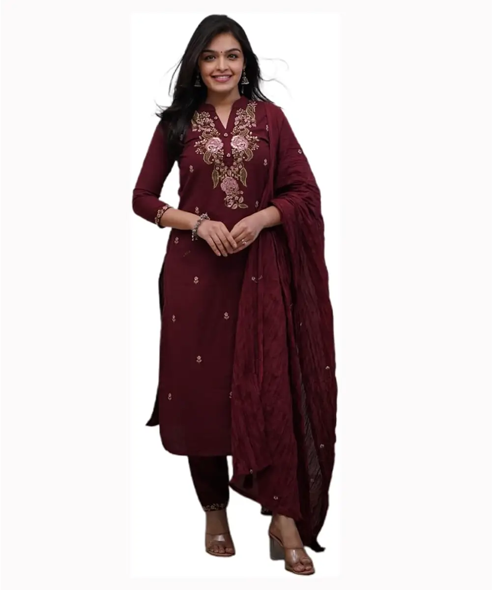 A model is wearing a dark maroon embroidered cotton kurta, palazzo and dupatta set.