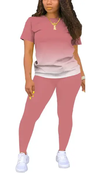 A woman modeling a grey 2-piece outfit consisting of a solid, short-sleeve crew neck pullover top and matching long leggings.