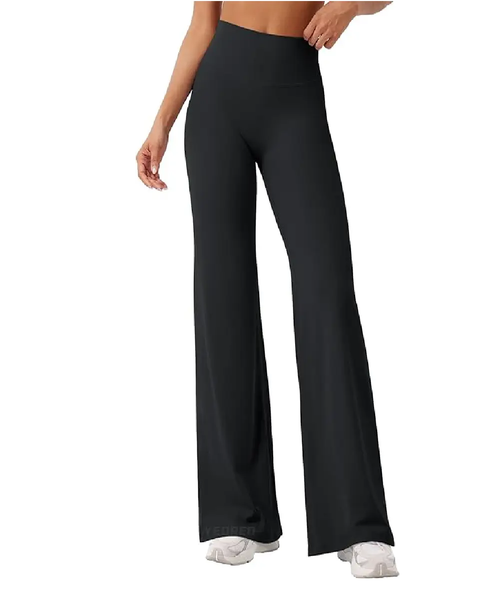 A woman wearing dark blue high-waisted wide-leg dress pants with side pockets and a belt, styled for a professional office look.