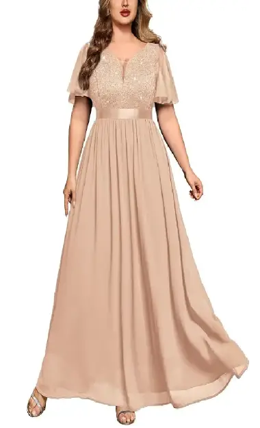 A plus-size model wearing a flowy champagne-colored A-line formal dress with a sequin lace bodice, V-neck, and ruffle tulle short sleeves.