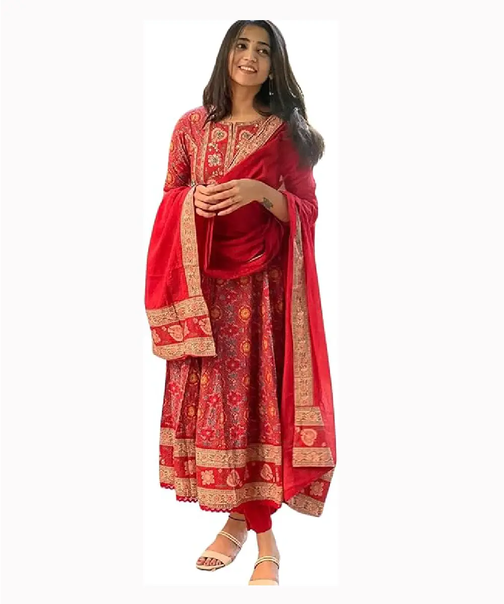 A model wears red floral printed pure cotton anarkali kurta, matching pants and dupatta set.