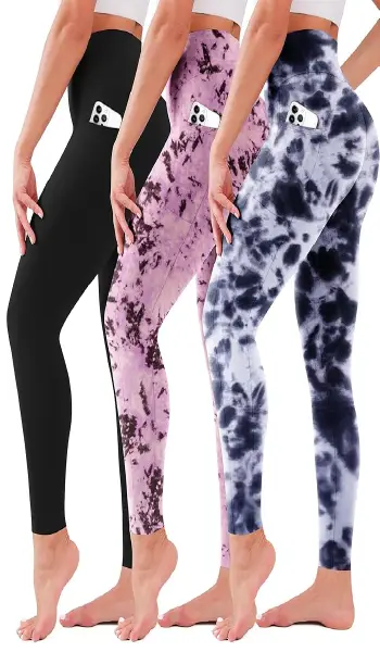 Three women modeling the same style of high-waisted leggings with side pockets in black, purple tie-dye, and grey tie-dye colors.