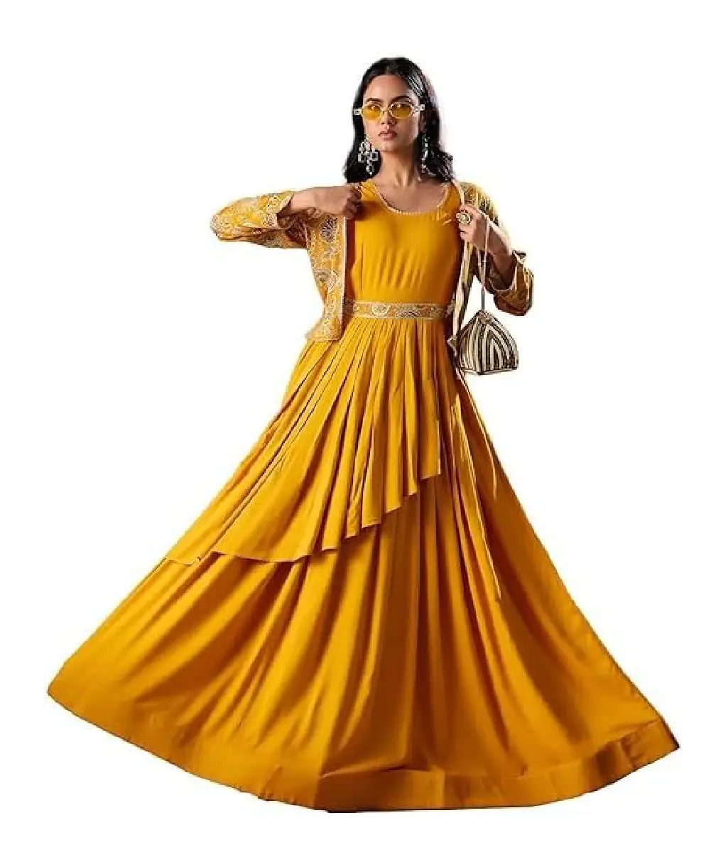 A woman wearing a sophisticated wine-colored georgette Anarkali-style kurta with detailed embroidery, paired with matching pants and a dupatta.