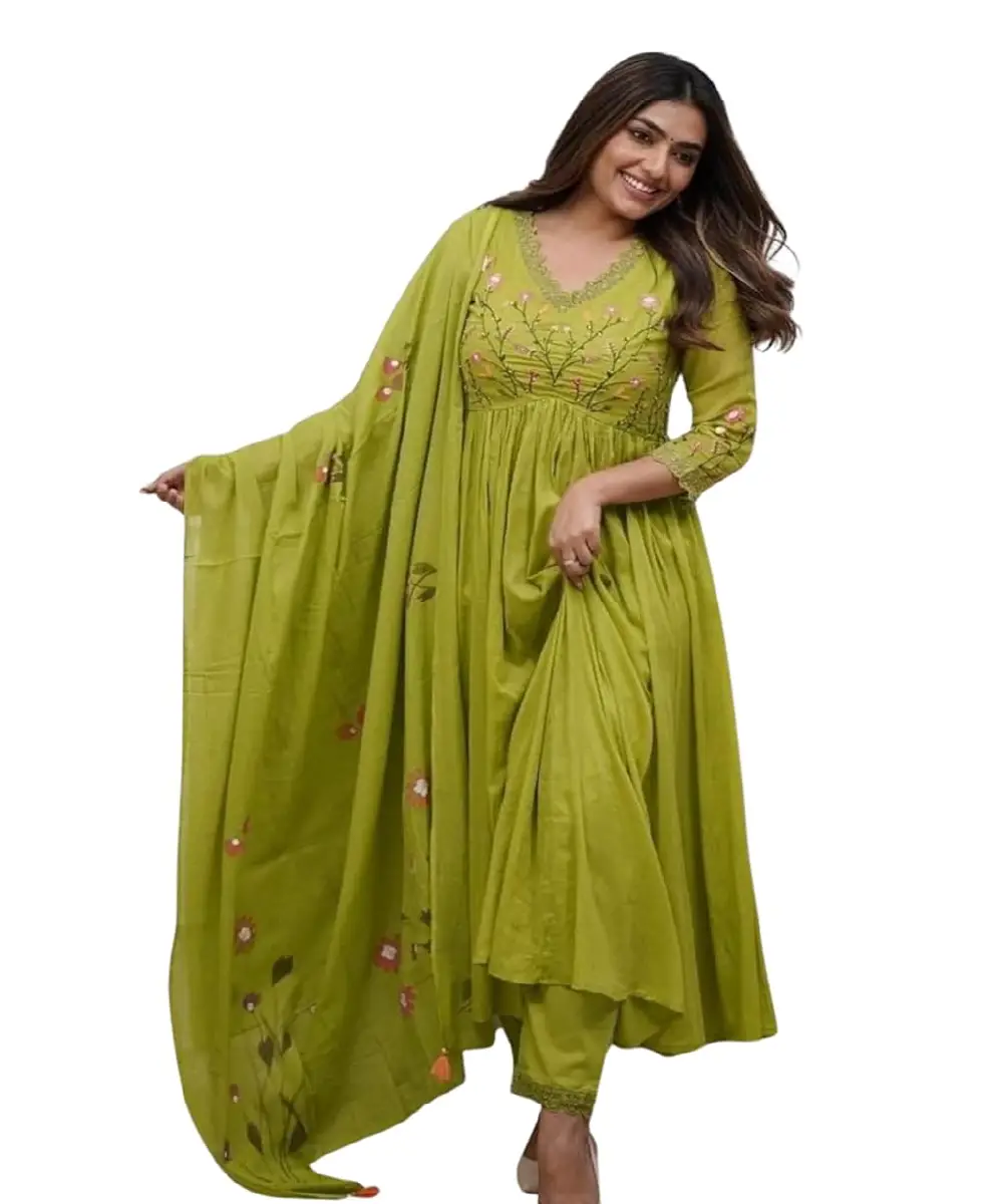 A woman wearing a vibrant pink georgette Anarkali-style kurta with detailed embroidery, paired with matching pants and a dupatta.