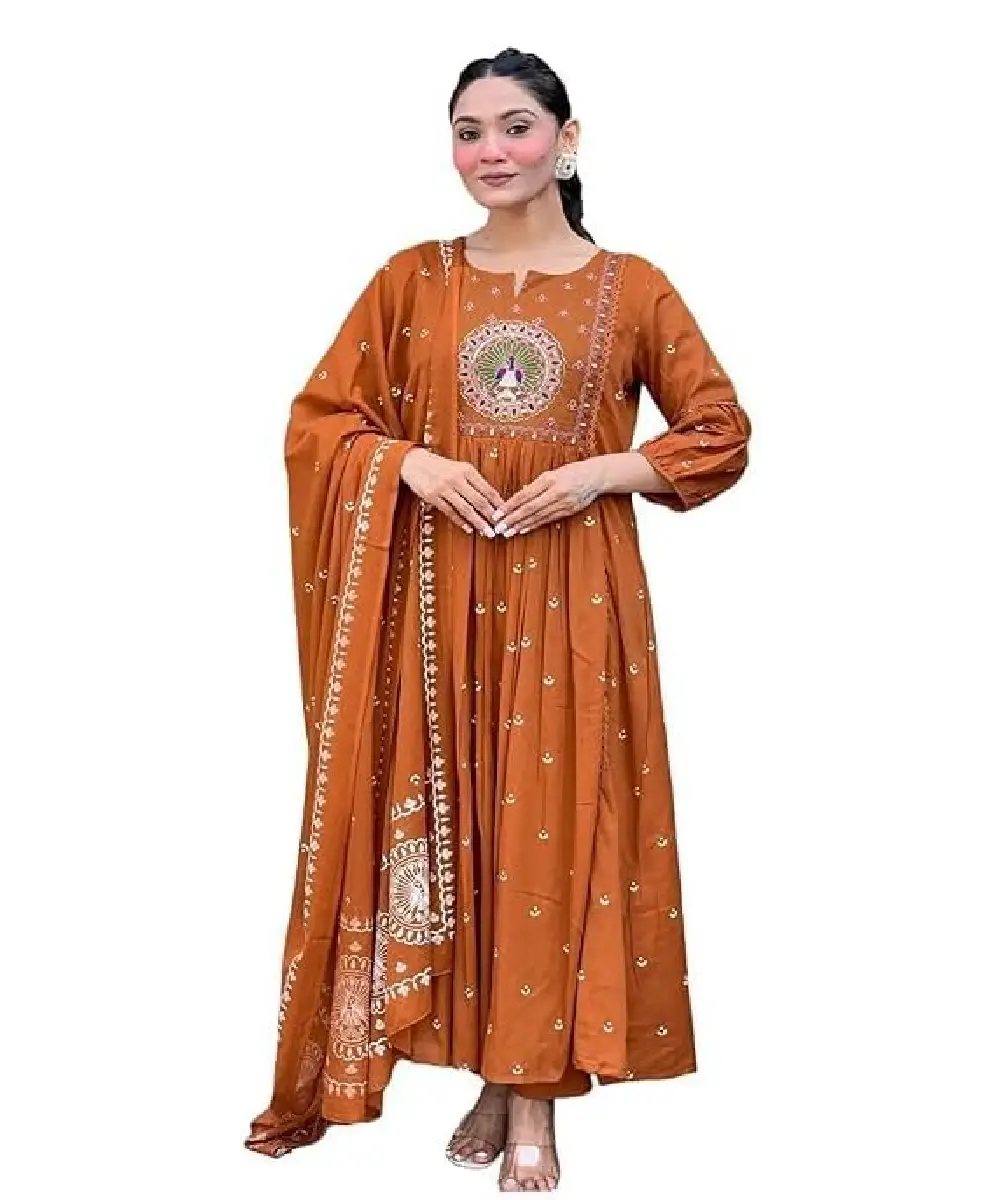 A woman wearing a vibrant mustard yellow georgette Anarkali-style kurta with detailed embroidery, paired with matching pants and a decorative dupatta.