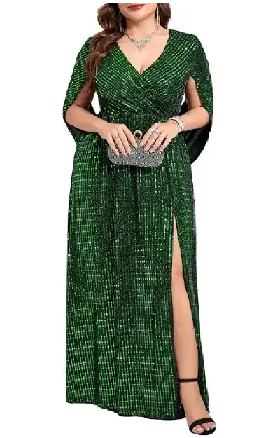 A plus-size model wearing a green sequin evening gown with a V-neck wrap bodice, dramatic cape sleeves, and a high leg slit.
