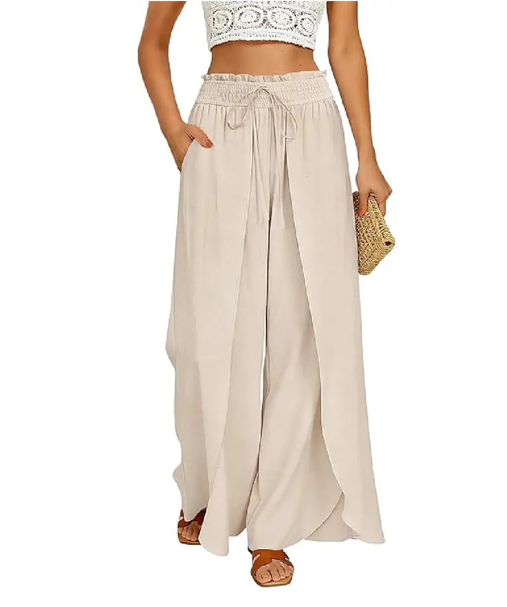 A woman wearing beige high-waisted linen wide-leg pants with a unique side-split design and an elastic drawstring waist, paired with a white crochet crop top.