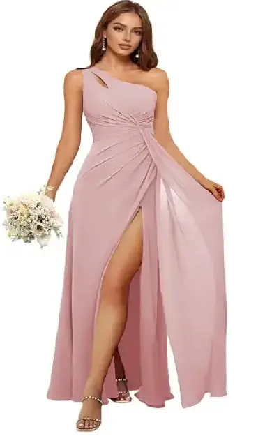 A woman modeling an elegant one-shoulder bridesmaid dress made from soft, flowy dusty pink chiffon, featuring a side slit.
