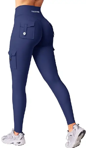 A woman modeling blue cargo-style leggings with functional side pockets and a butt-lifting design.