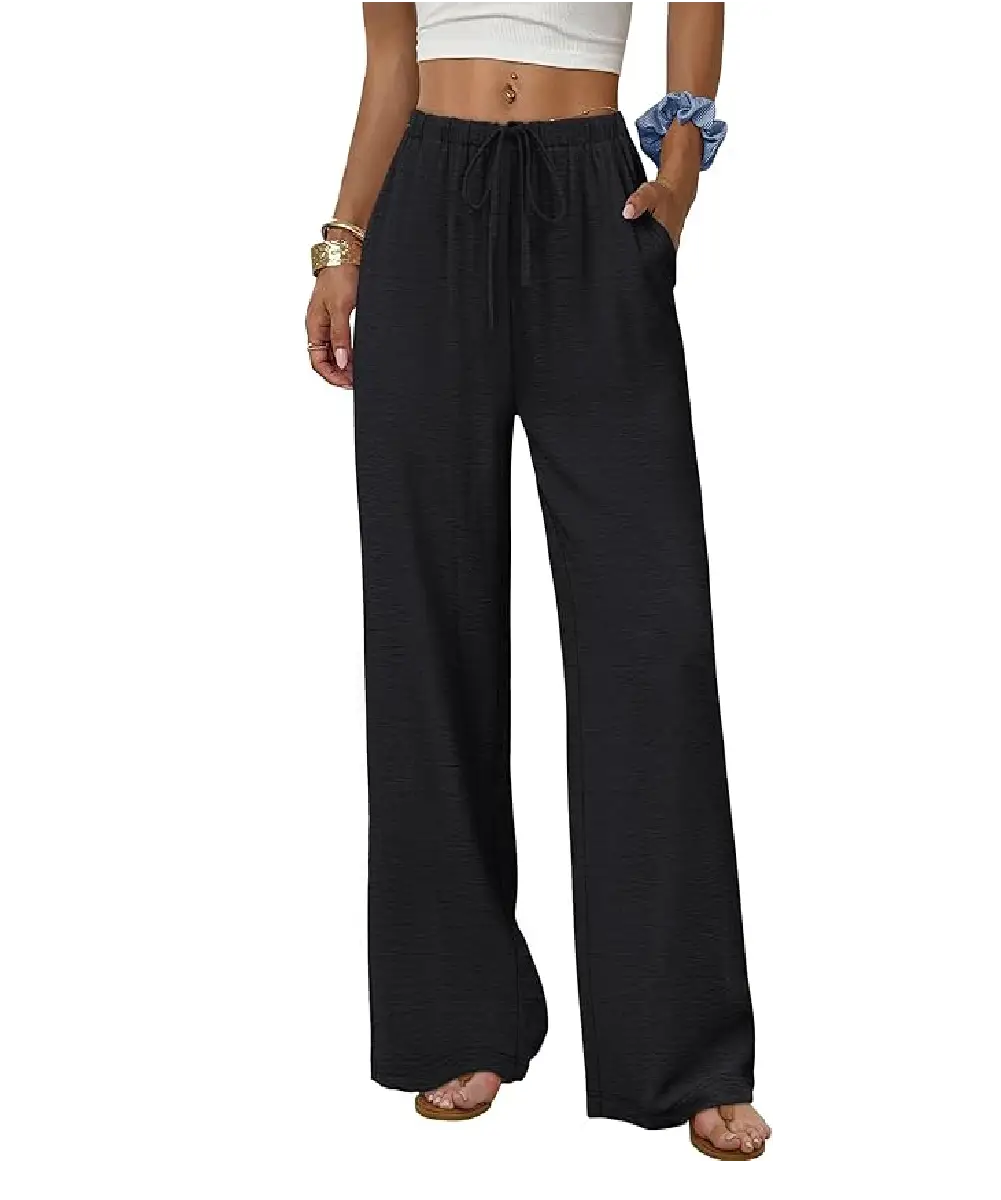 A woman wearing pink high-waisted wide-leg dress pants with side pockets and a belt, styled for a professional office look.