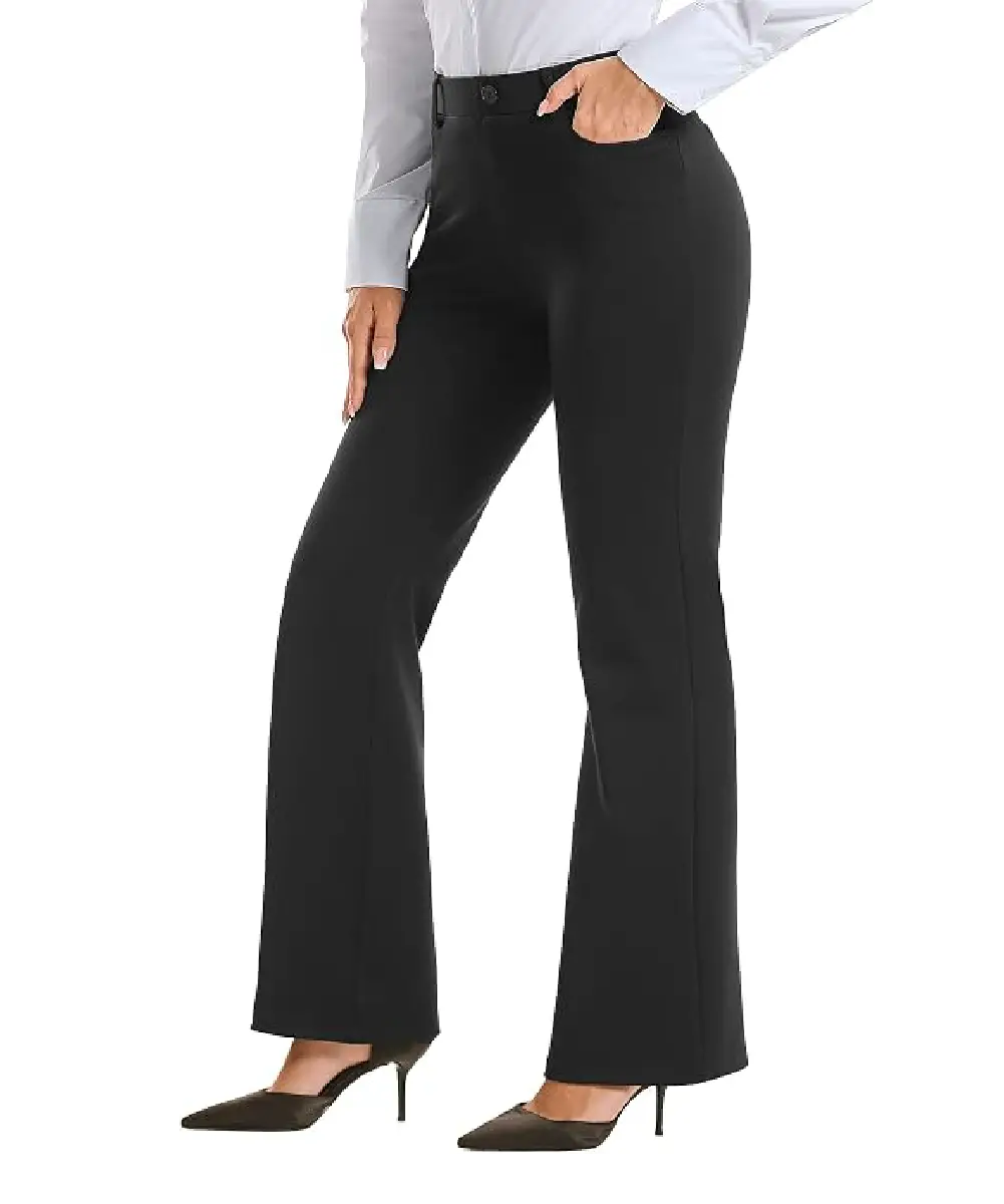 A woman wearing solid black, boot-cut dress pants with a professional appearance, styled with a white shirt and heels.