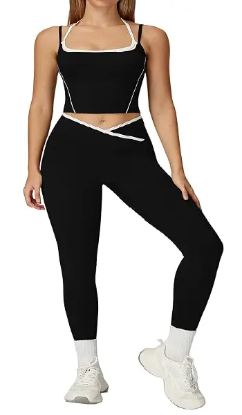 A woman modeling a blue 2-piece athletic yoga set featuring a spaghetti strap backless tank top and matching high-rise leggings with contrast detailing.
