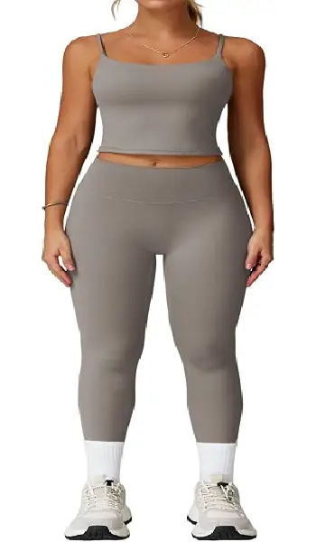 A woman modeling a blue 2-piece athletic yoga set featuring a spaghetti strap backless tank top and matching high-rise leggings with contrast detailing.