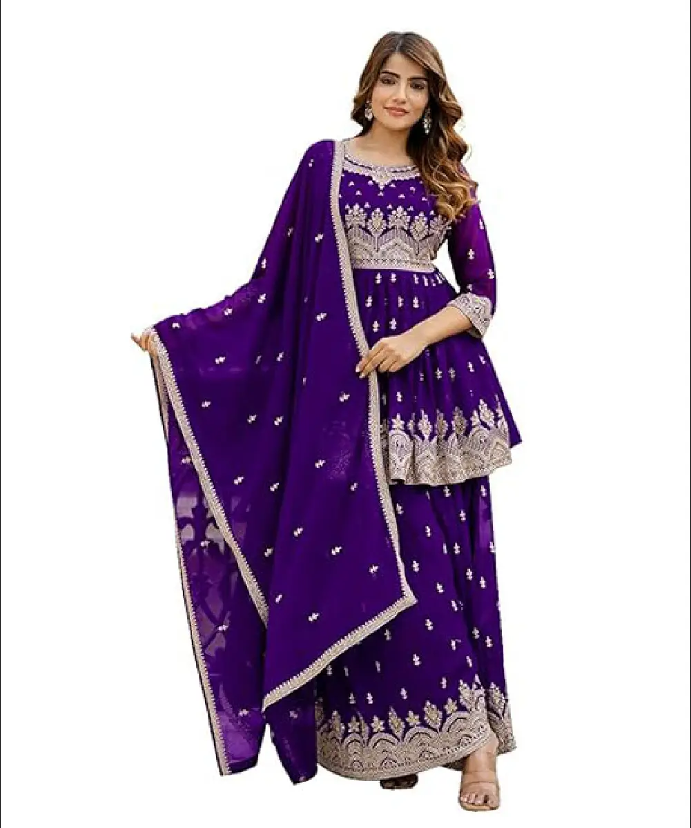 A woman wearing a stylish purple georgette pleated kurta and sharara suit set, featuring intricate embroidery work and a matching dupatta.