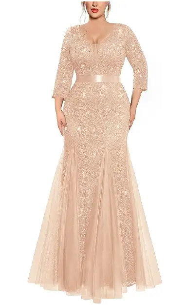 A plus-size model wearing an elegant floor-length champagne gown featuring a sequin lace design, double V-neckline, 2/3 length sleeves, an empire waist, and a tulle mermaid hemline.