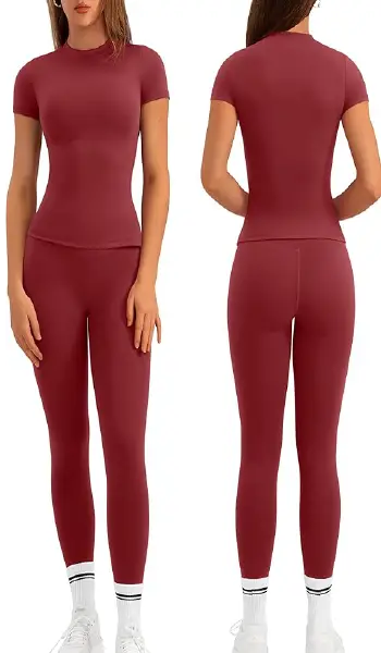 A woman modeling a purple 2-piece workout set featuring a short-sleeve crew neck shirt and matching high-rise, no-front-seam leggings.