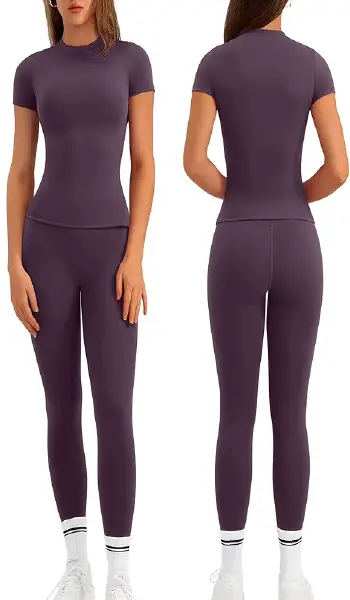 A woman modeling a purple 2-piece workout set featuring a short-sleeve crew neck shirt and matching high-rise, no-front-seam leggings.