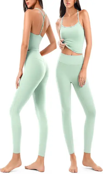 A woman modeling a light green 2-piece workout set featuring a spaghetti strap crop tank top and matching high-waisted seamless leggings.