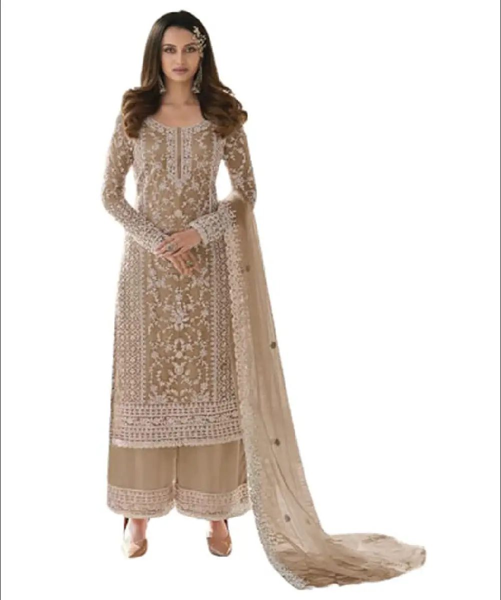 A model wears beige heavily embroidered faux georgette sharara palazzo suit and dupatta.