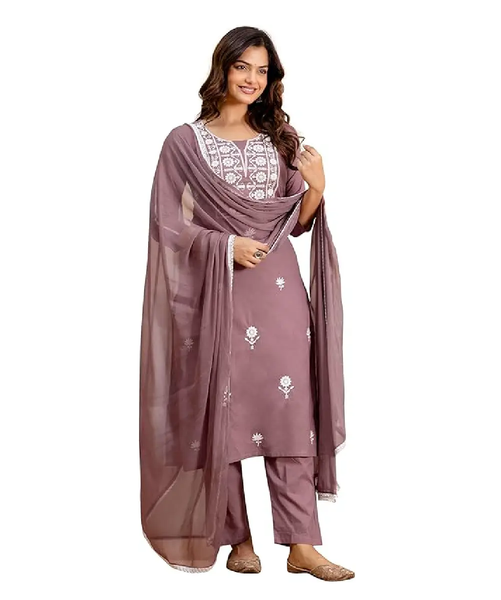 A woman wearing a vibrant red Anarkali-style kurta with elegant floral prints, paired with matching pants and a dupatta.