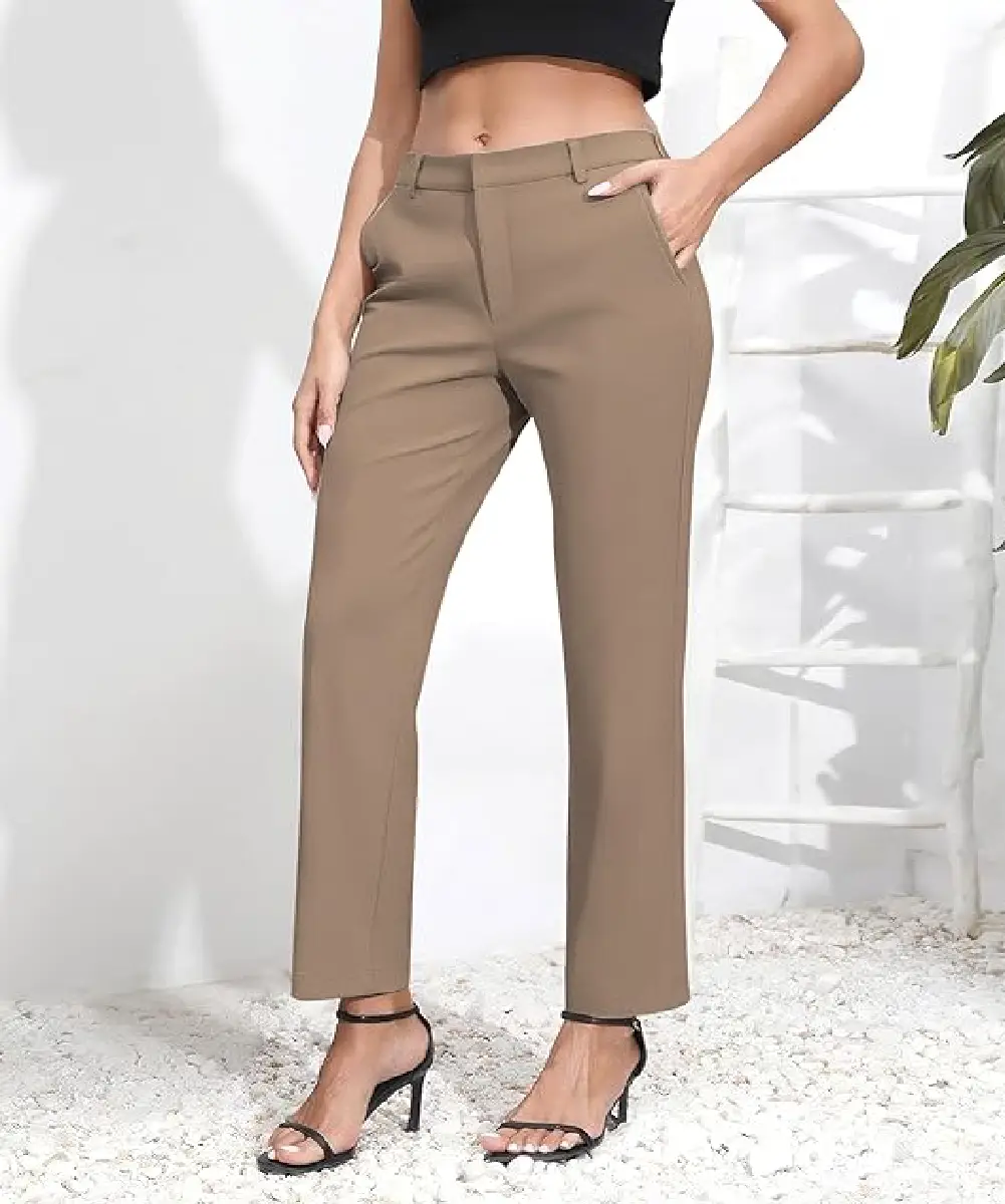 A woman wearing camel-brown high-waisted wide-leg dress pants with side pockets and a belt, styled for a professional office look.