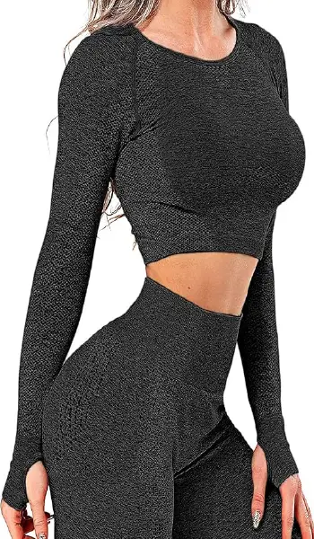 A woman wearing a black seamless long sleeve crop top featuring a dotted contouring pattern and thumbholes on the cuffs.