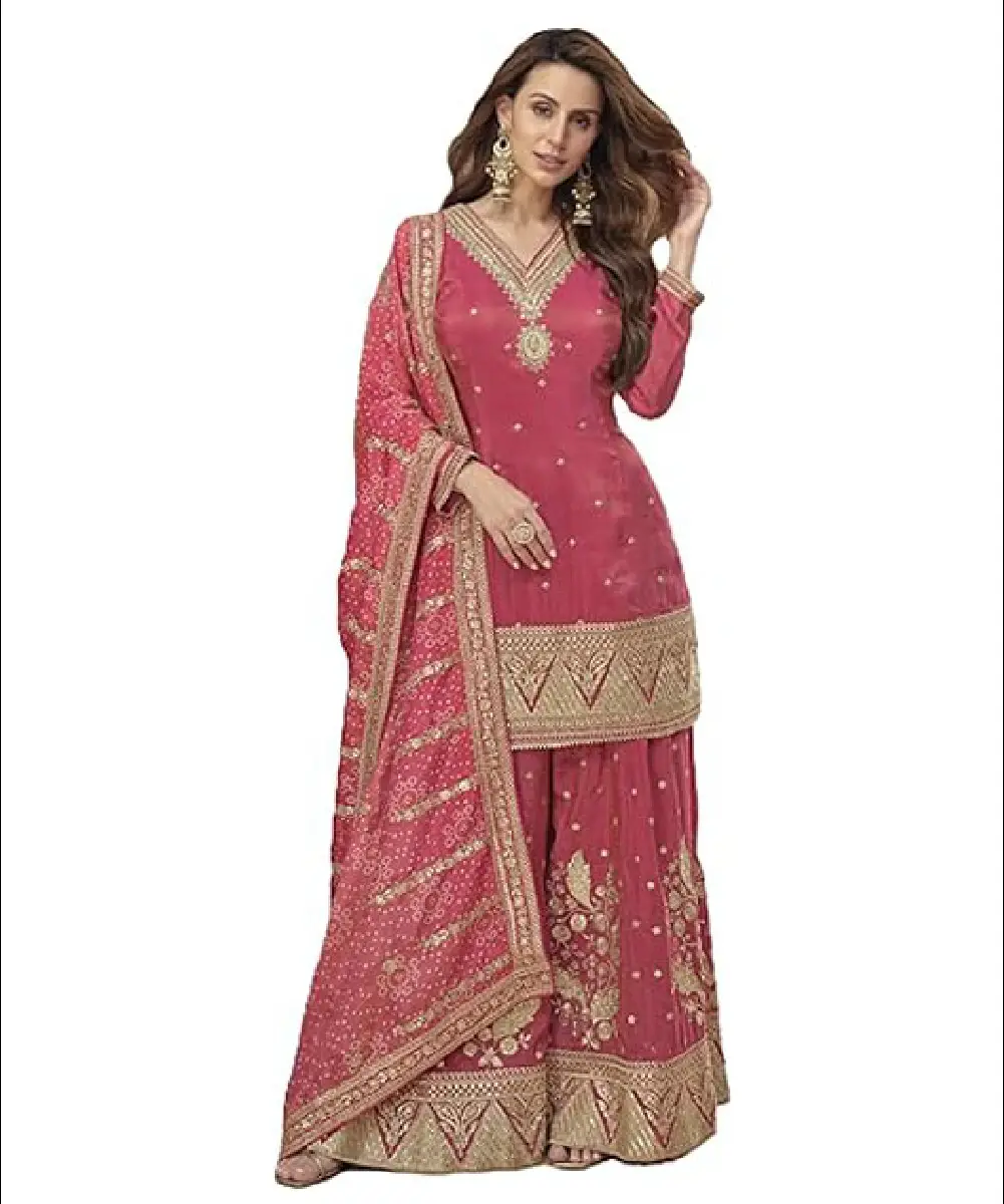 A woman wearing a beautiful pink ready-to-wear salwar suit made of cosmos silk, featuring intricate embroidery work and a printed tabby silk dupatta.
