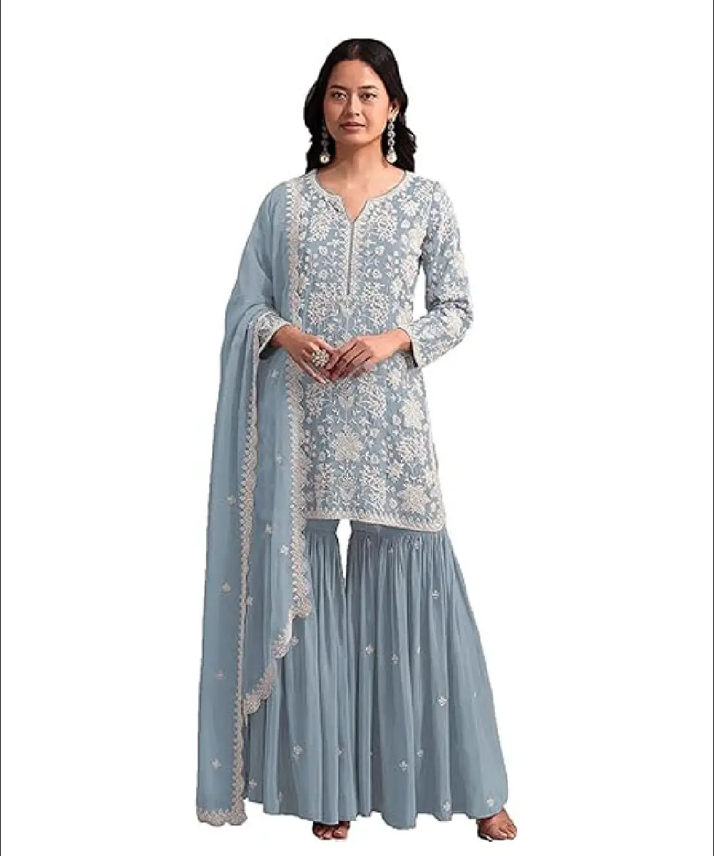 A woman wearing a blue ready-to-wear salwar suit featuring intricate sequin, embroidery, and handwork, paired with a matching dupatta.