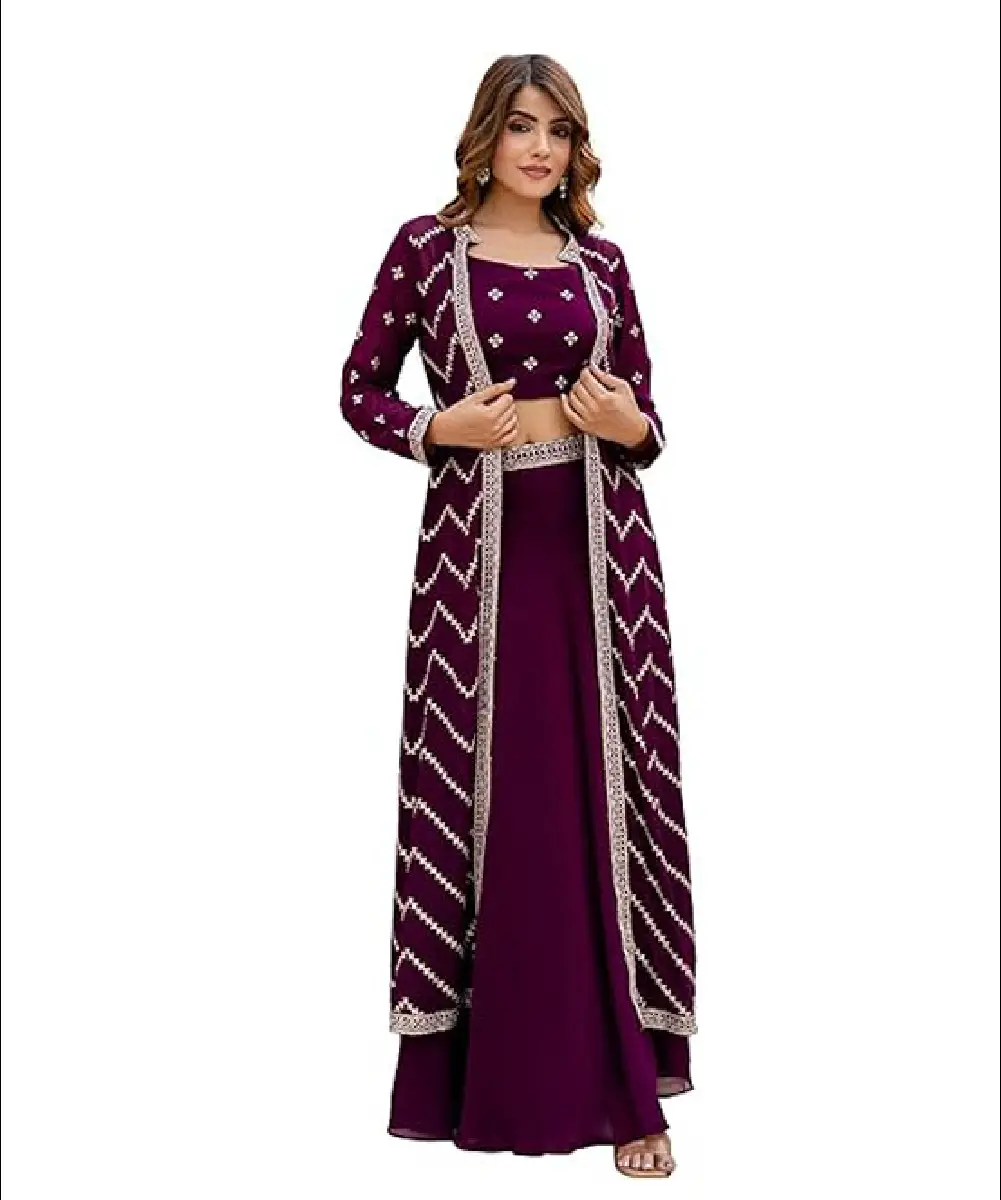 A woman wearing a sophisticated purple fusion set featuring a crop top, a floor-length lehenga, and a matching shrug with intricate sequin embroidery.